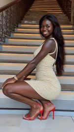 0244-A smiling woman with long dark hair sits-FluxFlux1_DNSFWstoiqoNewrealityFLUXS-1579889460.jpeg